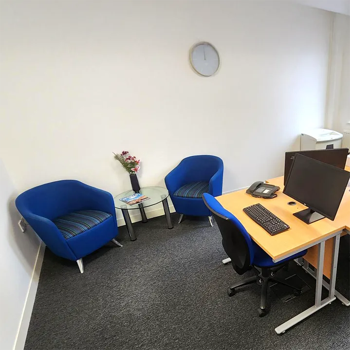 Office with comfortable blue chairs