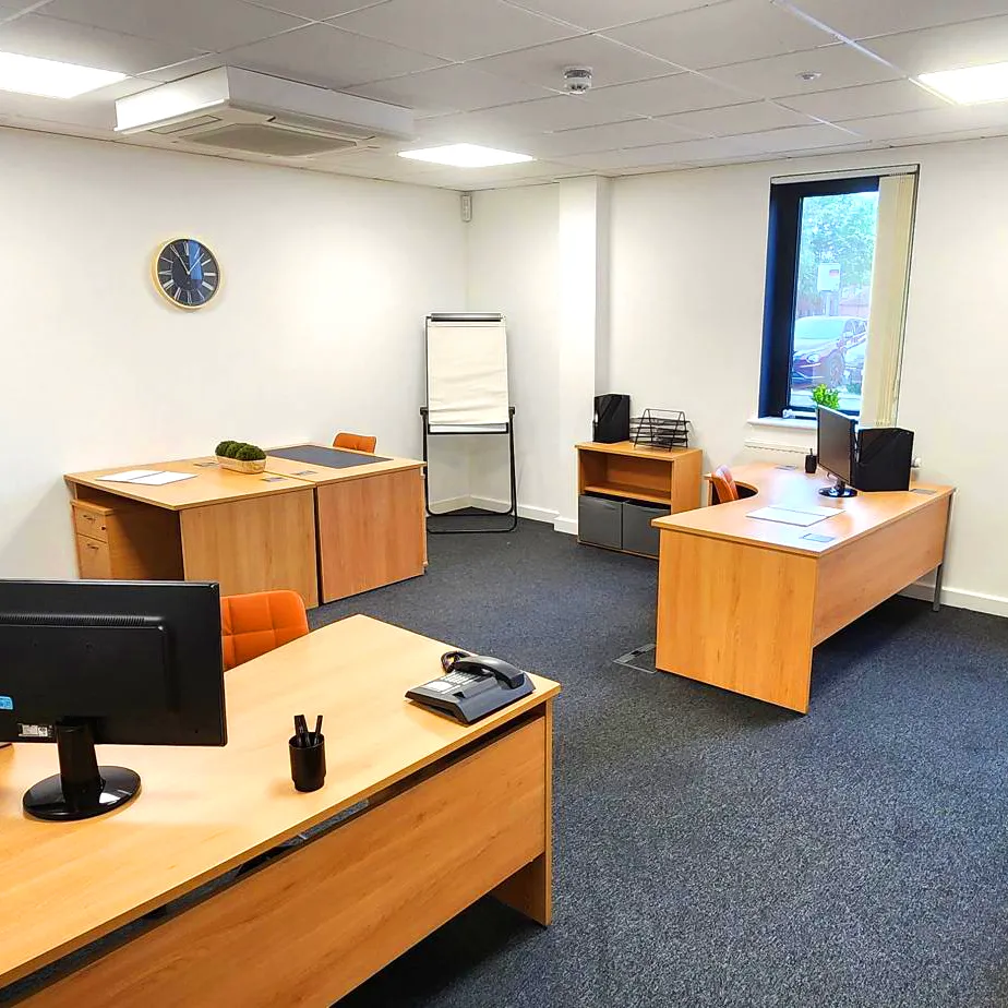 Contemporary desk and cushioned chair in workspace